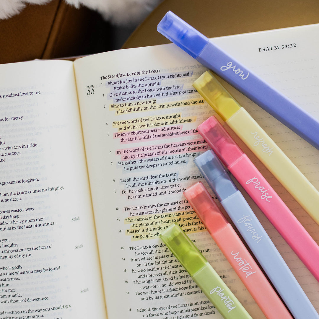 Colorful Bible highlighters with highlighted Bible passages in Psalm