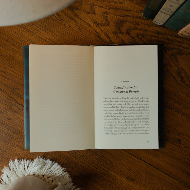 The Good Christian Girl Book opened to chapter 7 on a wooden table