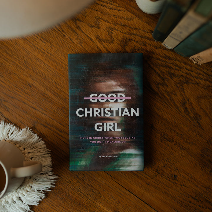 The Good Christian Girl Book cover on a wooden table