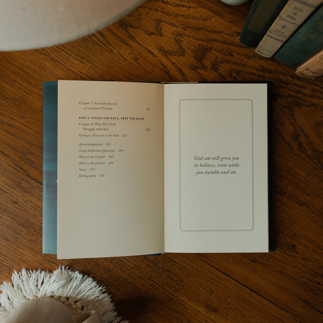 The Good Christian Girl Book opened to the end of the table of contents page on a wooden table