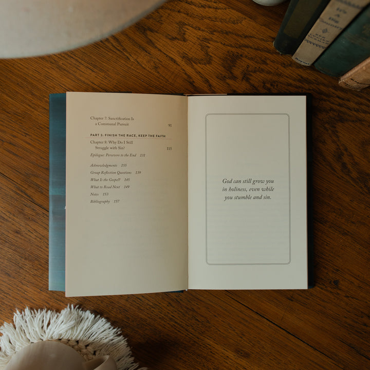 The Good Christian Girl Book opened to the end of the table of contents page on a wooden table