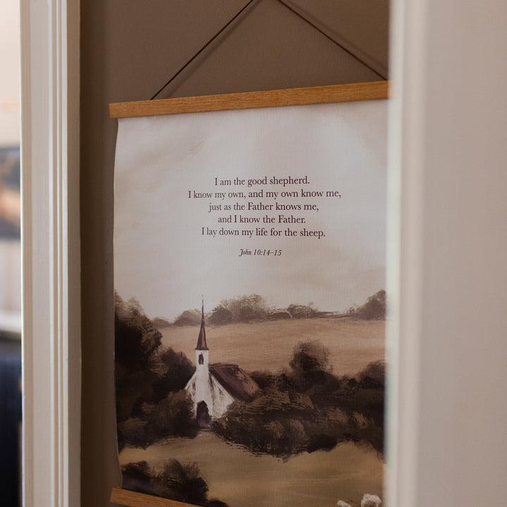 The Good Shepherd Print hanging on a brown painted wall