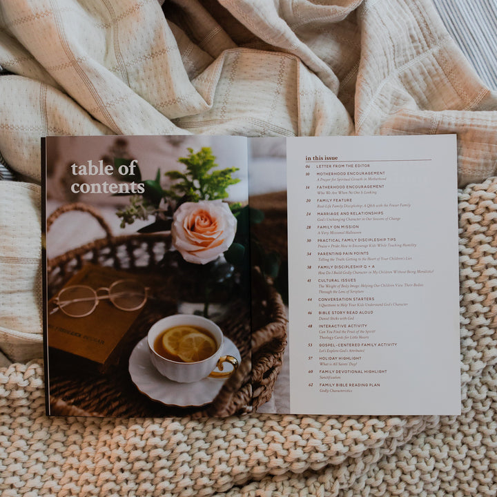 Gospel at Home Issue 9 Magazine opened to the table of contents on two blankets, one that is knitted and one that is smooth