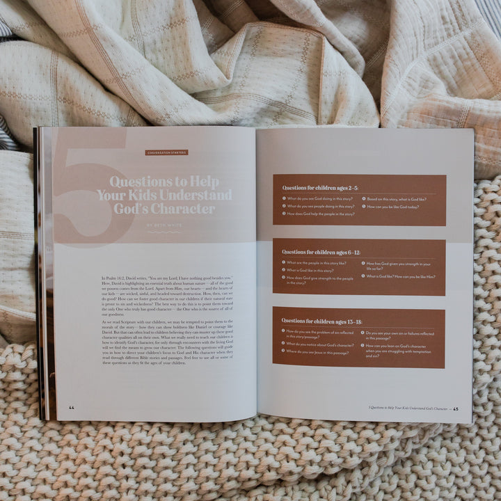 Gospel at Home Issue 9 Magazine opened to questions to help your kids understand God's character page on two blankets, one that is knitted and one that is smooth
