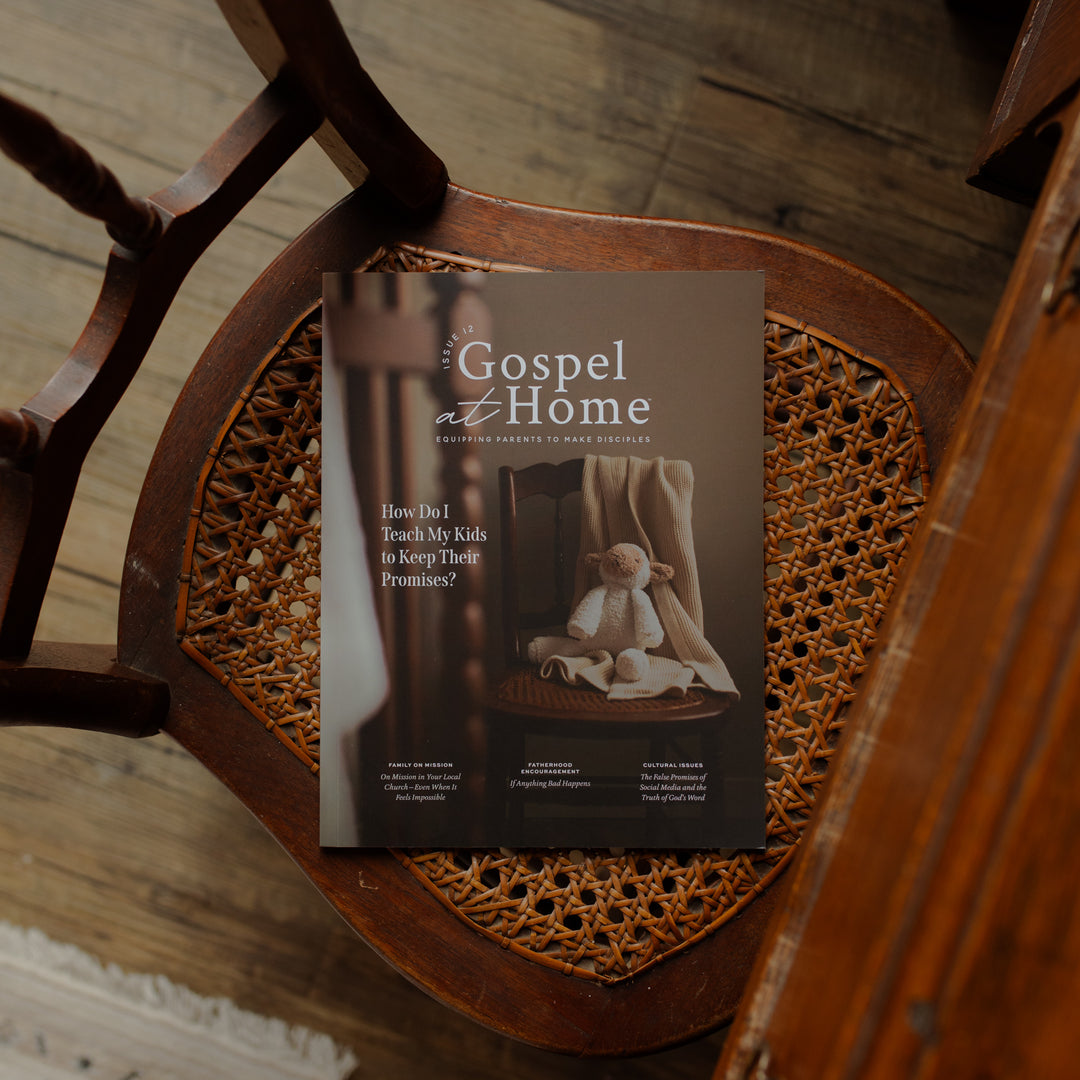 Book titled 'The Gospel at Home' on a wooden wicker chair