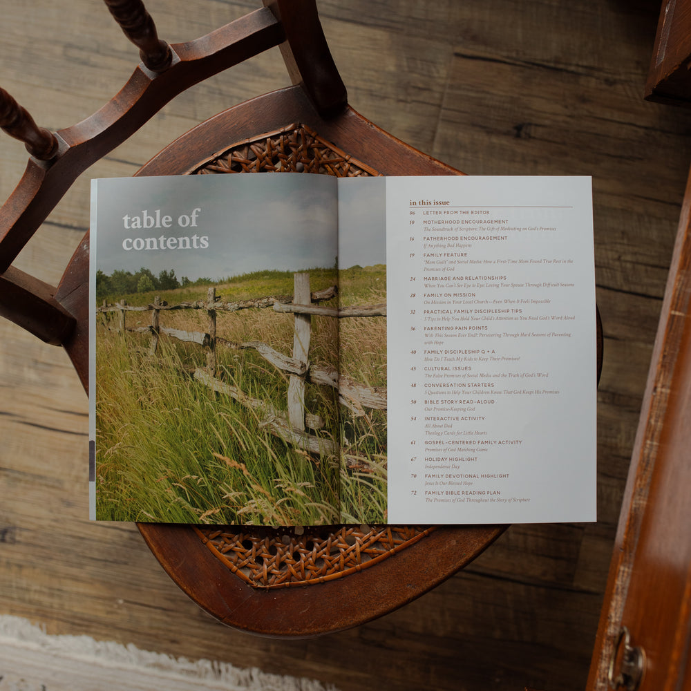 Open book with a table of contents on a wooden surface