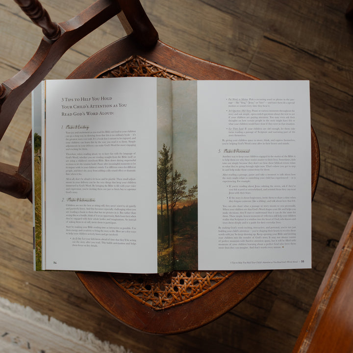 Open book on a wooden chair with nature-themed pages