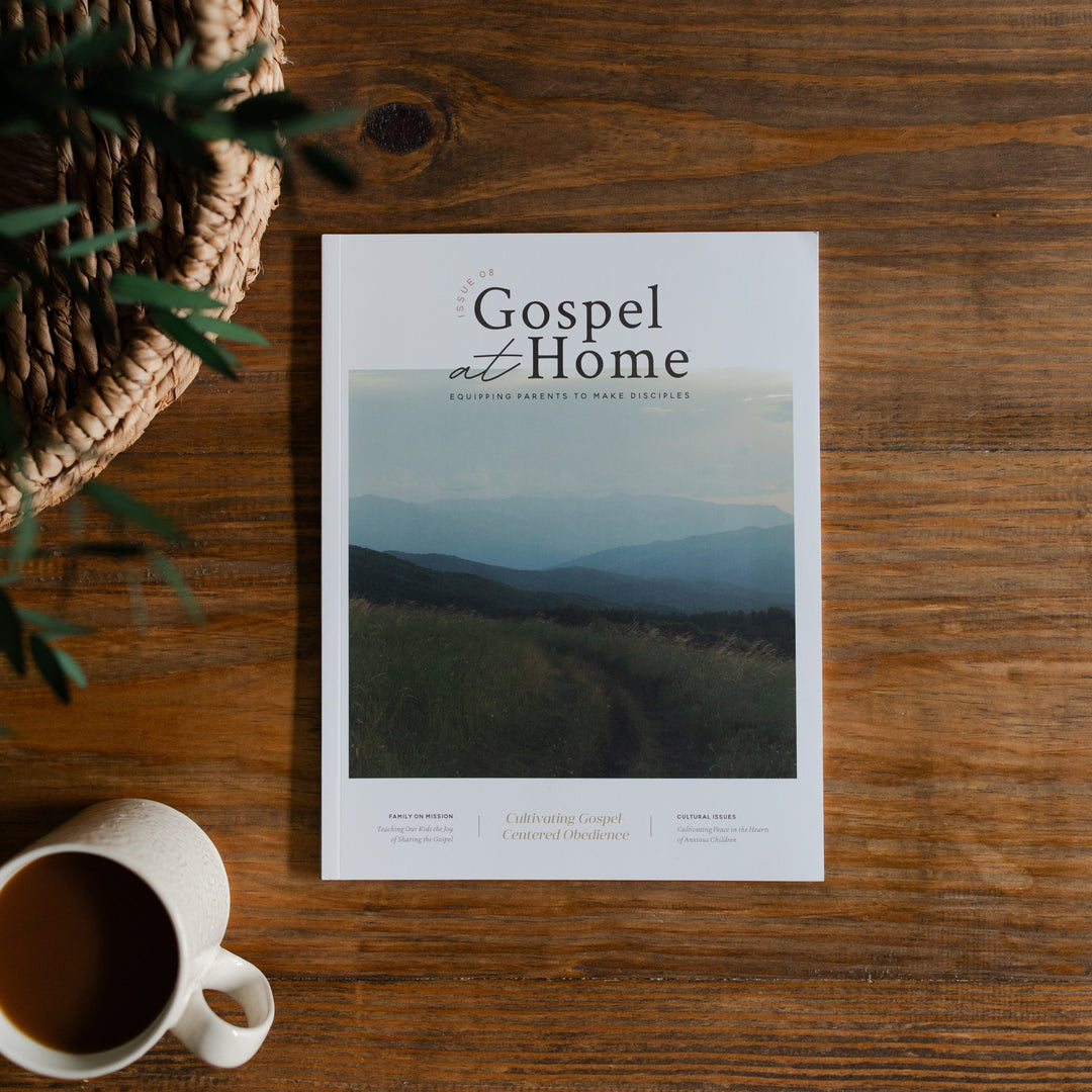 Gospel at Home Issue 8 Cover Page on a wooden table next to a coffee cup and a woven basket
