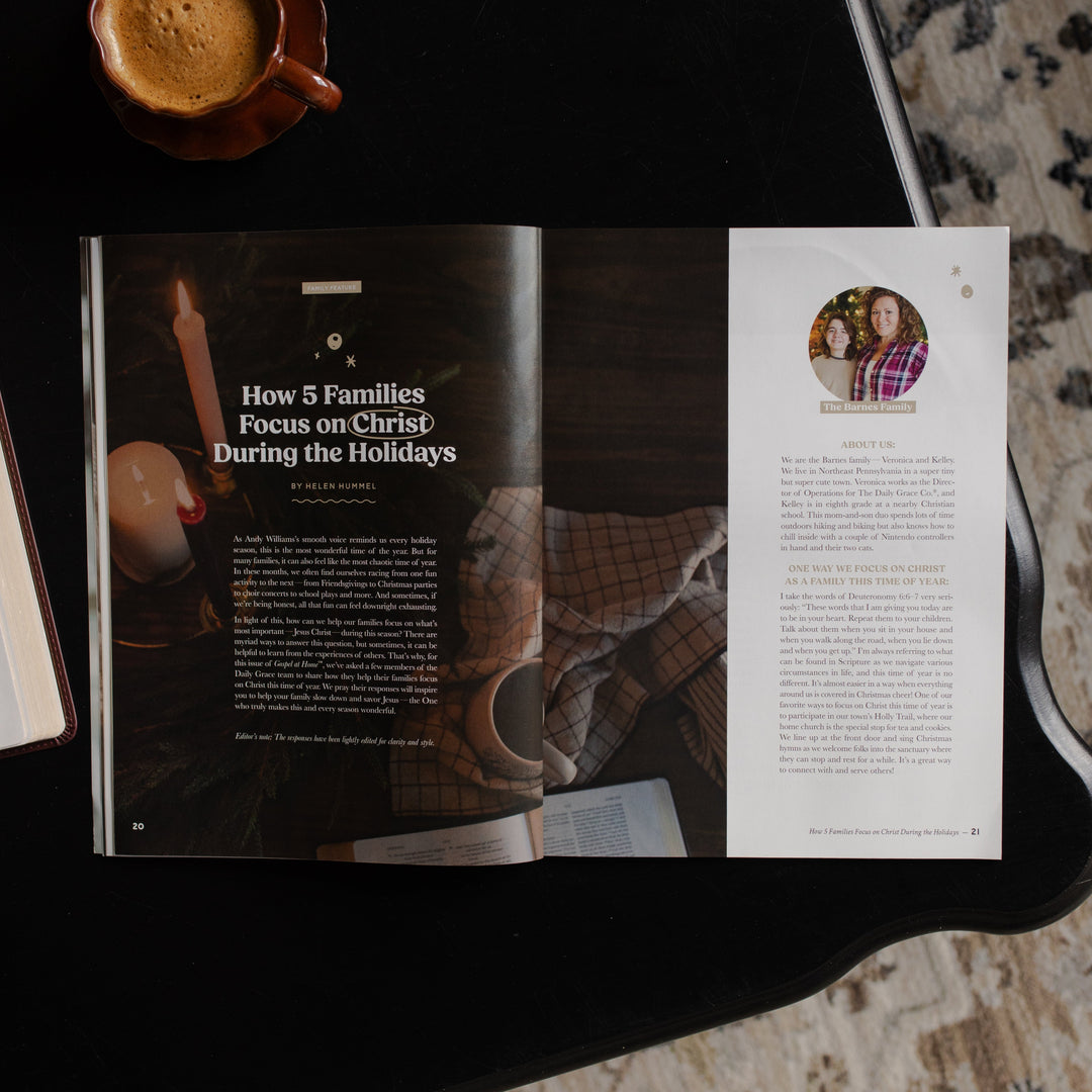 Gospel at Home Issue 10 opened to the How 5 families focus on Christ during the Holidays page on a black table near a coffee cup