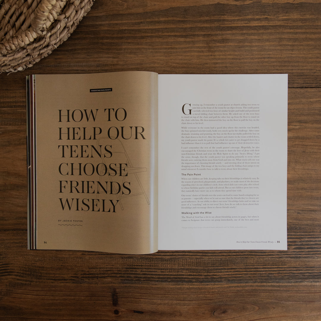An open magazine spread laid flat on a dark wood surface, with the left page featuring the large title 'HOW TO HELP OUR TEENS CHOOSE FRIENDS WISELY' in black serif text on a tan background, and the right page containing article text on white paper. A woven basket edge is visible in the top-left corner.
