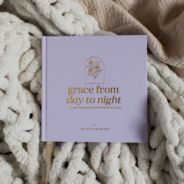 Grace from Day to Night a 40 day morning and evening devotional laying on a blanket 