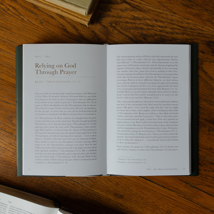 Grace in Every Season opened on a wooden surface with text visible