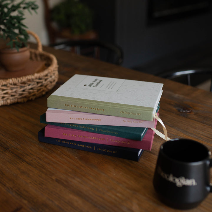 Top view of all five Bible handbooks stacked together on a table