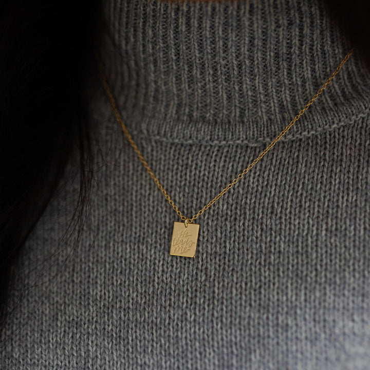 Up Close He Leads Me Necklace on a grey sweater 