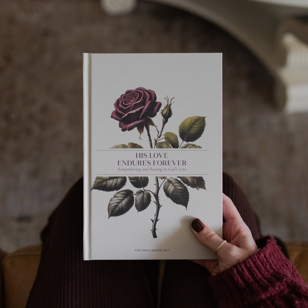 His Love Endures Forever book cover held by a woman's hand