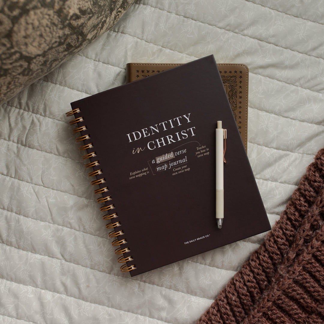 Identity in Christ Verse Map Journal on a bible on multiple blankets