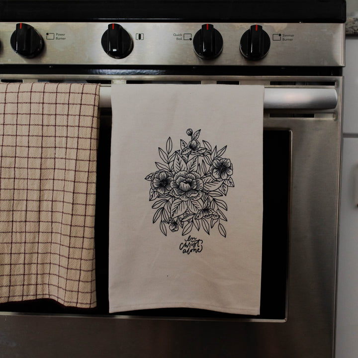 In Christ Alone tea towel on oven