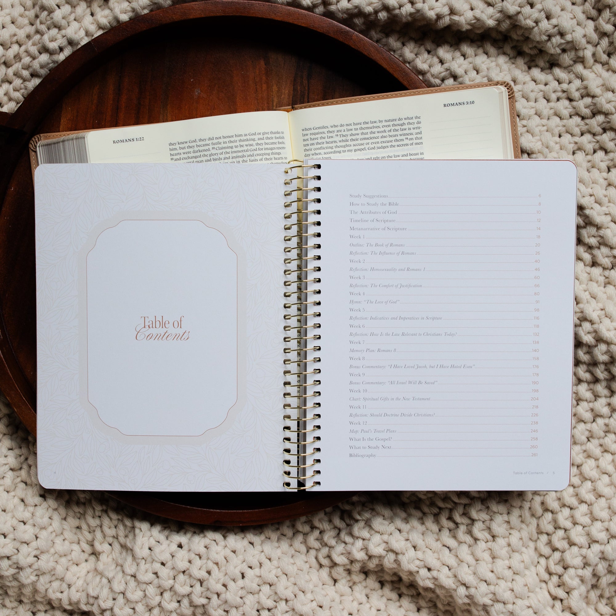 In Christ Alone Study opened to the Table of Contents page on an open Bible on a wooden tray on a knitted blanket
