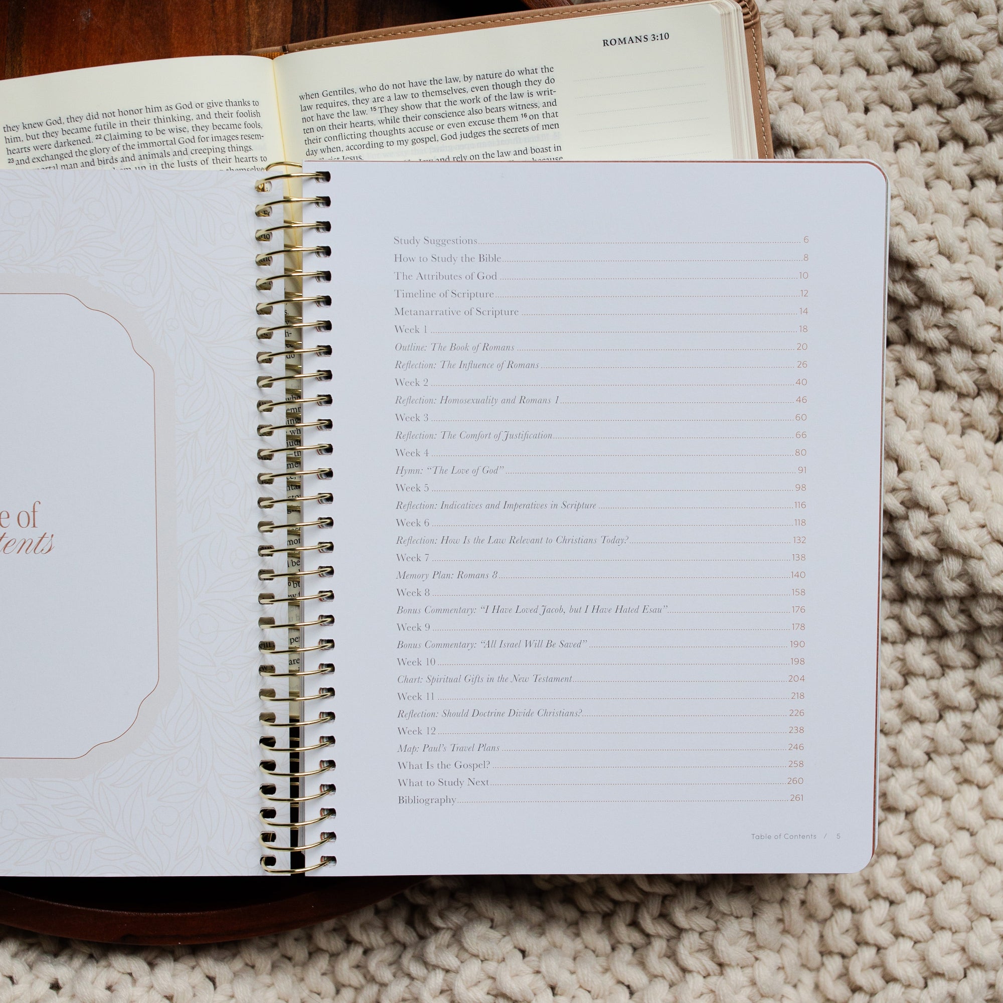 In Christ Alone Study opened to the Table of Contents page up close on an open Bible on a wooden tray on a knitted blanket