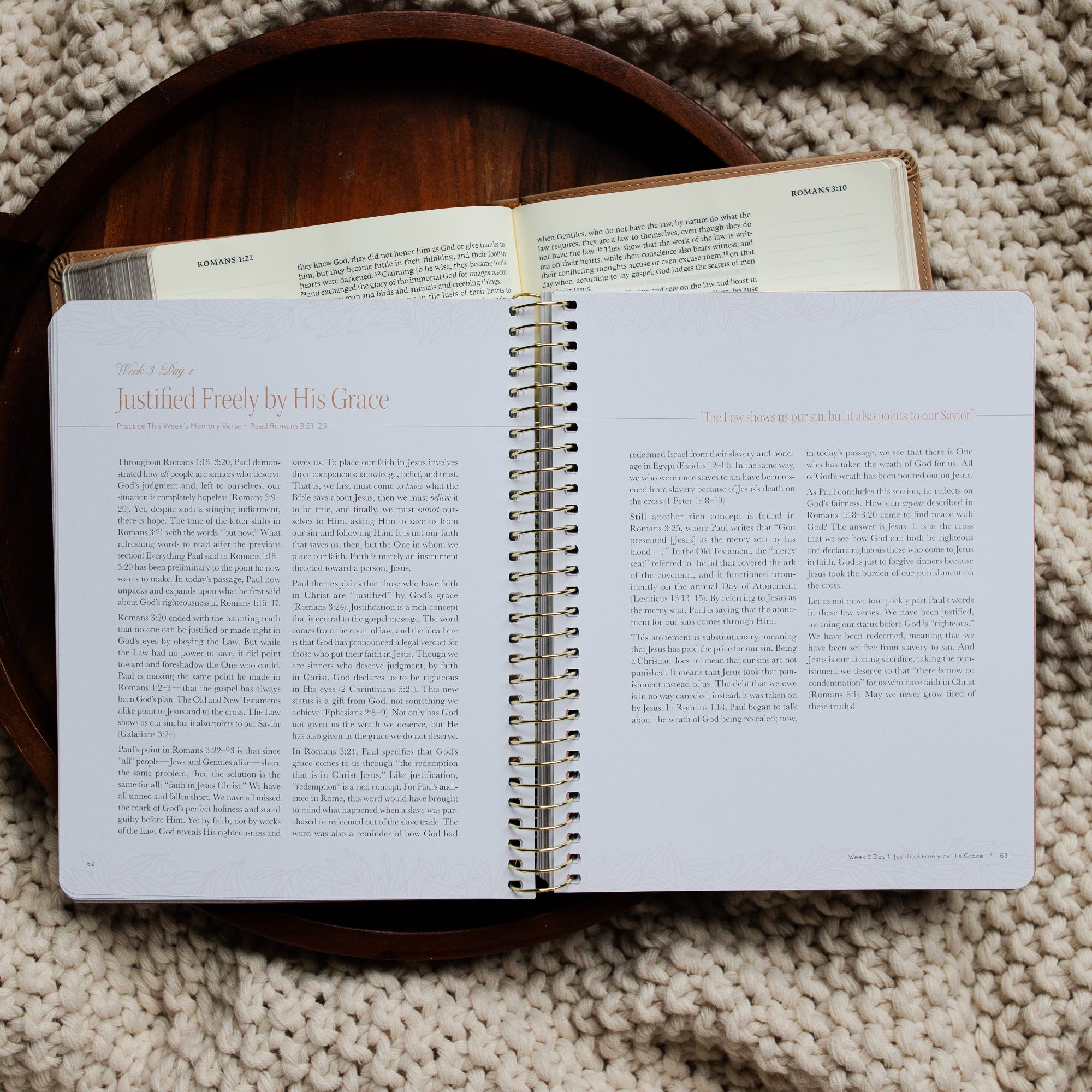 In Christ Alone Study opened to the Week 3 and Day 1 reading page on an open Bible on a wooden tray on a knitted blanket