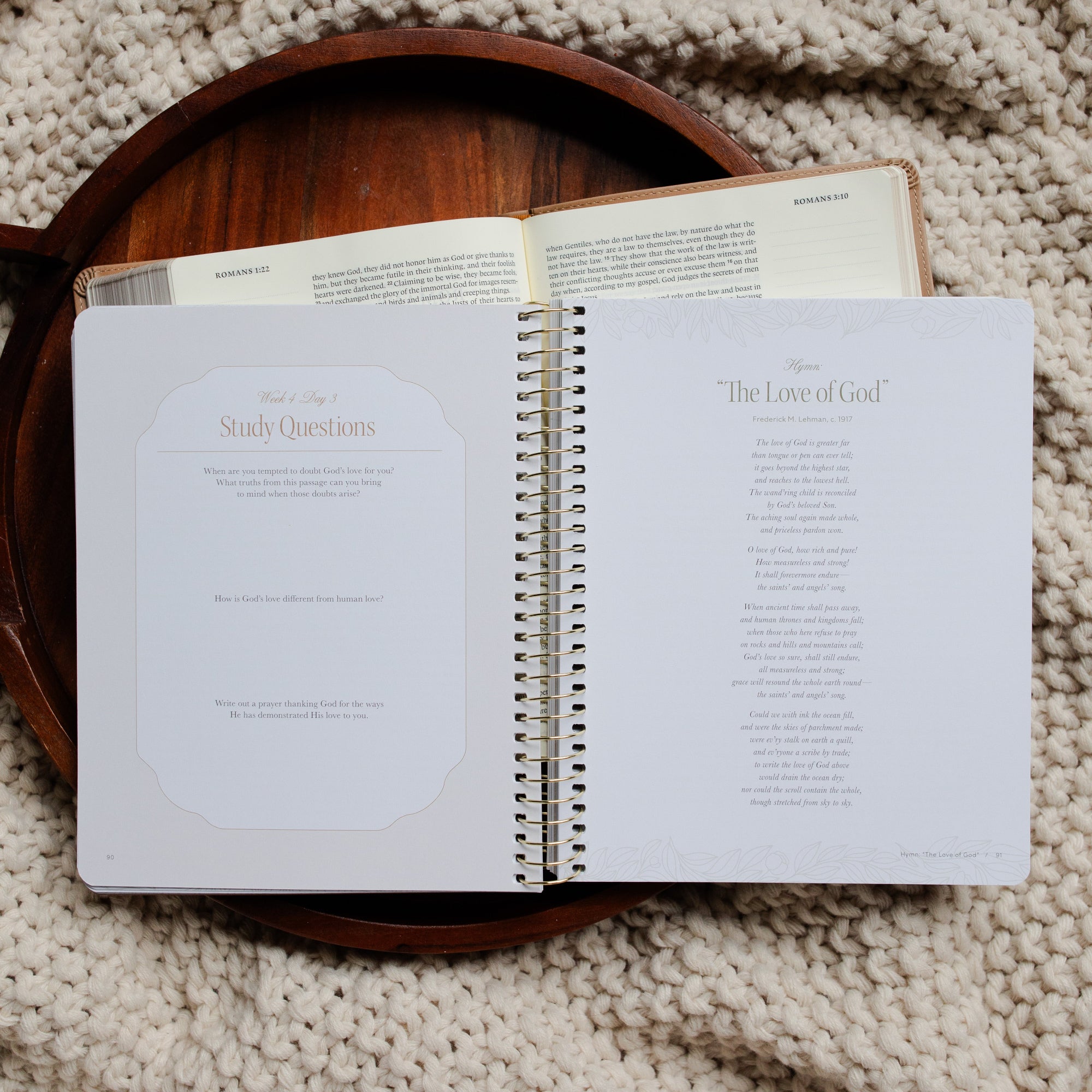 In Christ Alone Study opened to the Week 4 and Day 3 Study Questions page on an open Bible on a wooden tray on a knitted blanket