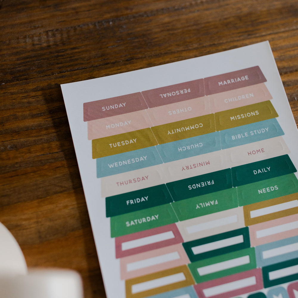 In Everything Journal Sticker Sheet up close of top half on a brown wooden table