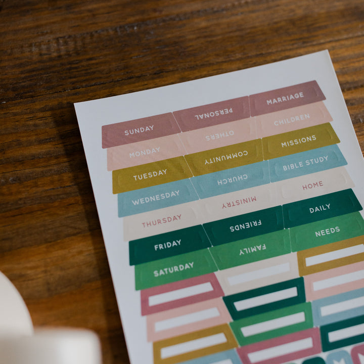 In Everything Journal Sticker Sheet up close of top half on a brown wooden table