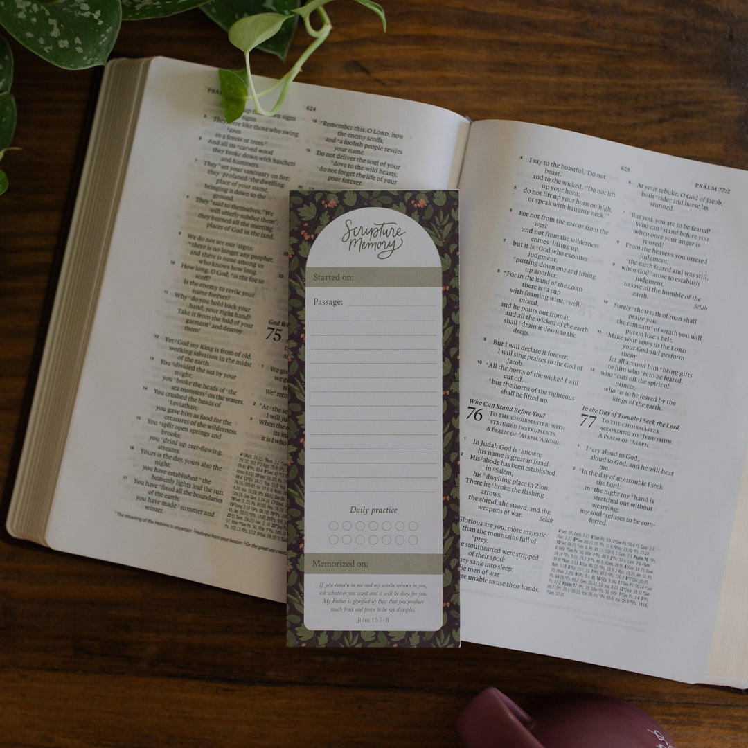 Scripture Memory Notepad sitting on an open bible