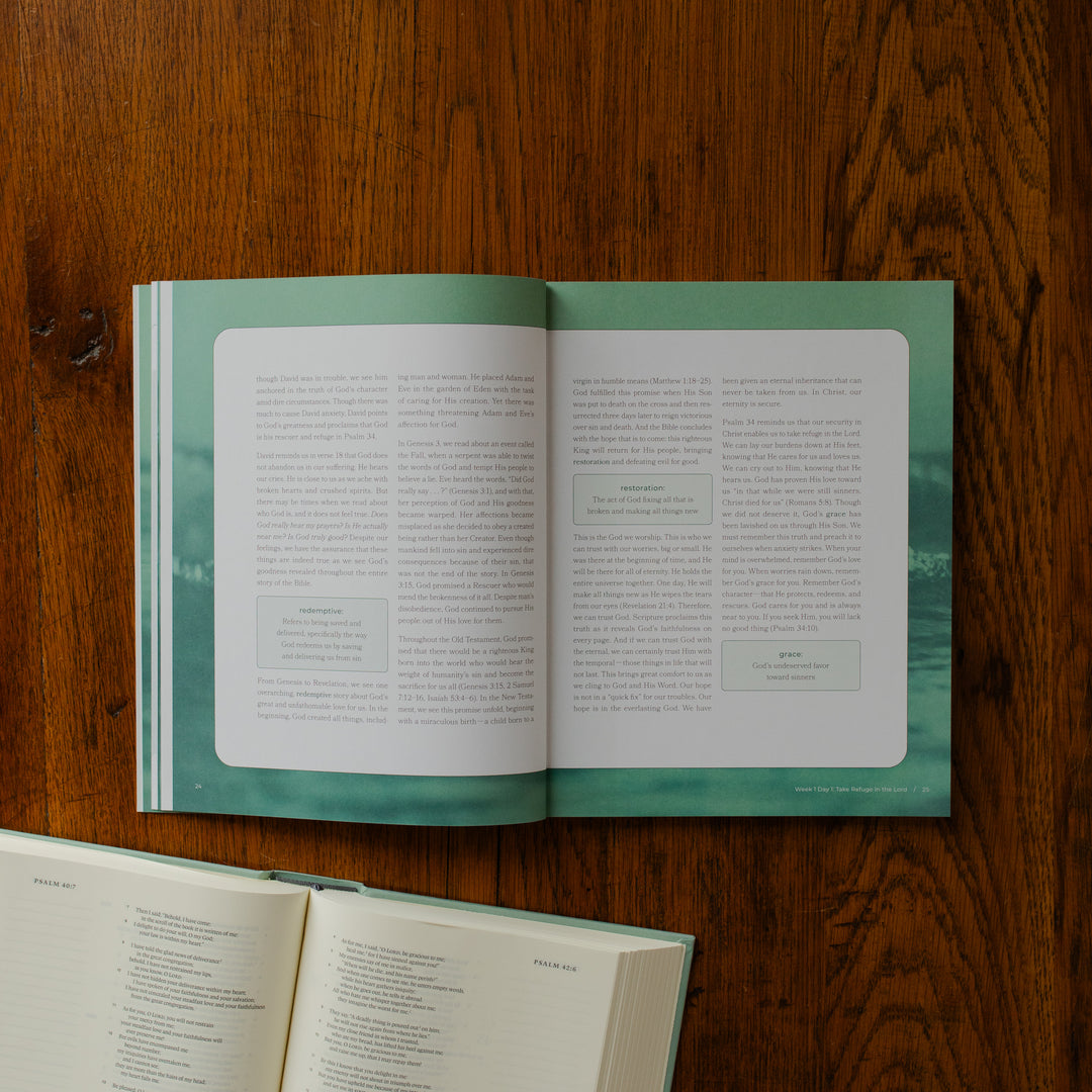 It is Well Teen Study opened to the week 1 day 1 reading page on a wooden table next to an open bible