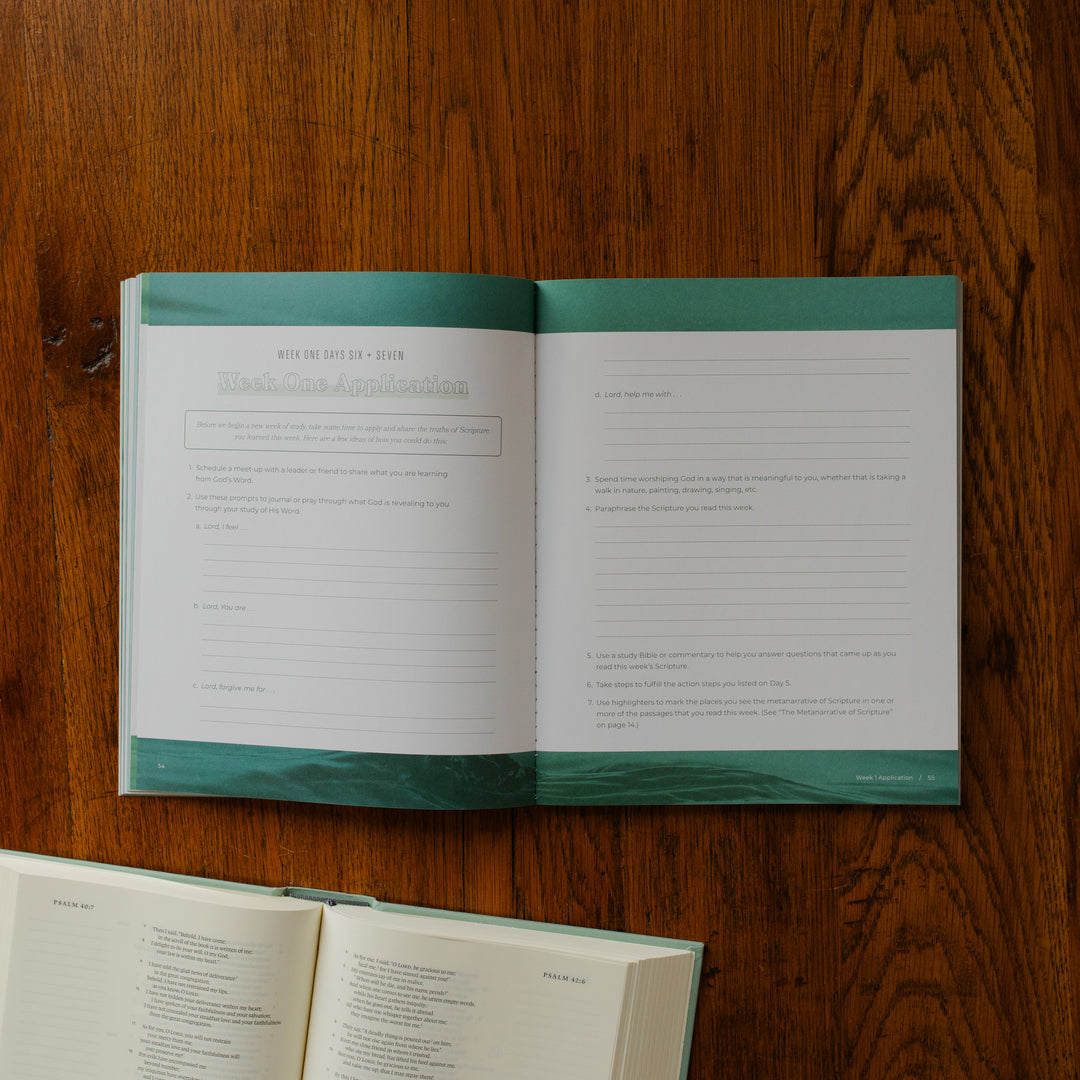 It is Well Teen Study opened to the week one application page on a wooden table next to an open bible