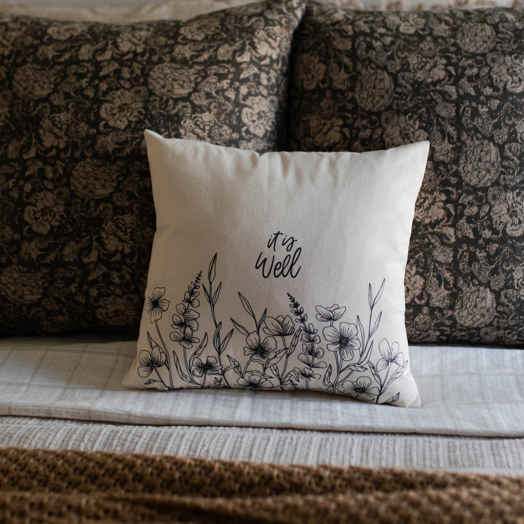 It is well wildflower pillow cover on a bed