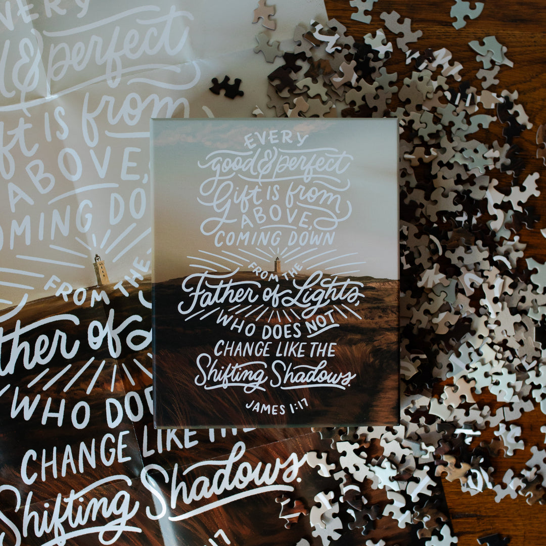 James Puzzle Box on a bunch of scattered puzzle pieces and the James Poster