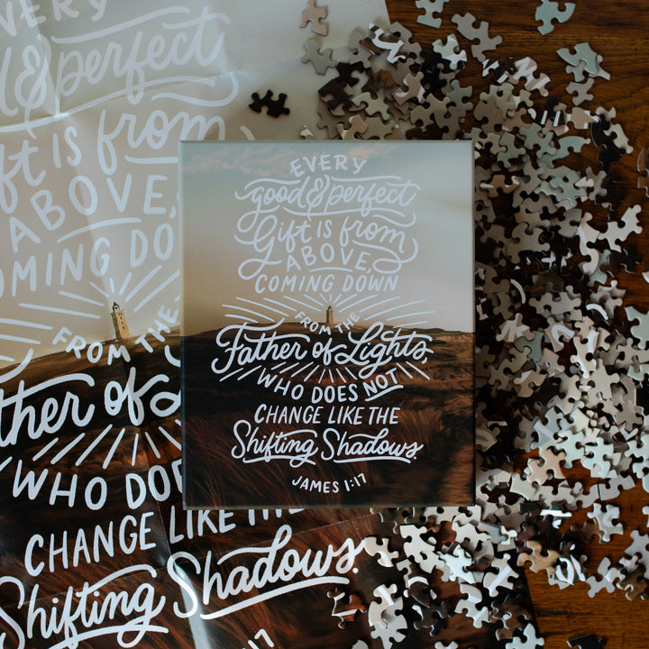 James Puzzle Box on a bunch of scattered puzzle pieces and the James Poster