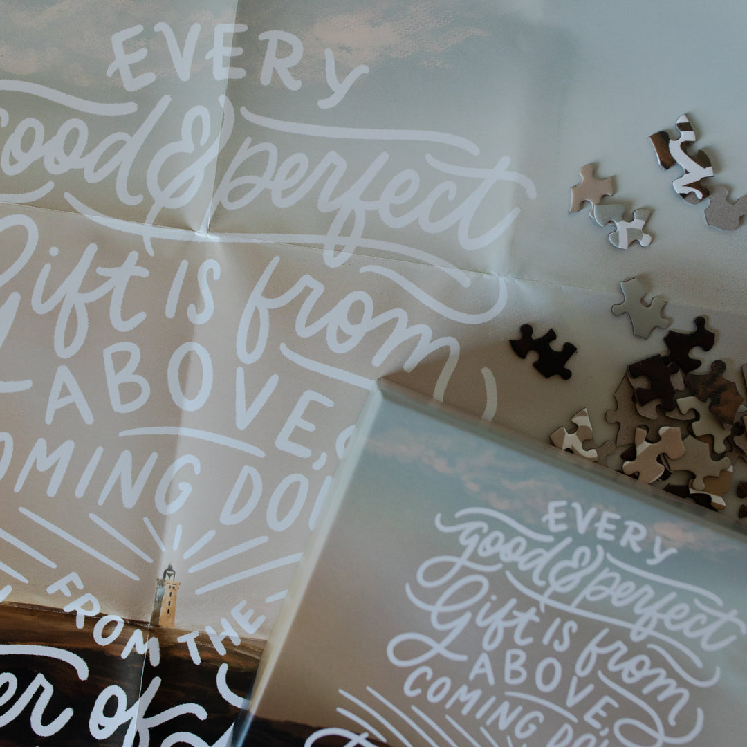 Up close of the James Puzzle poster on with some scattered puzzle pieces on it