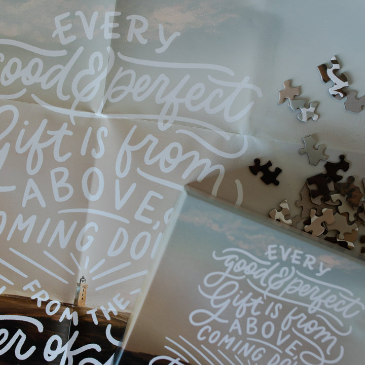 Up close of the James Puzzle poster on with some scattered puzzle pieces on it