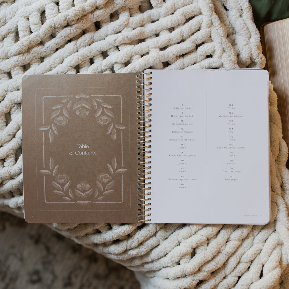 Jesus is Better study opened to the table of contents page laying on a white knitted blanket