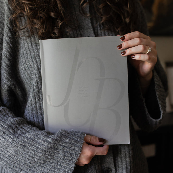 Job Study cover being held by a woman from the corners of the study