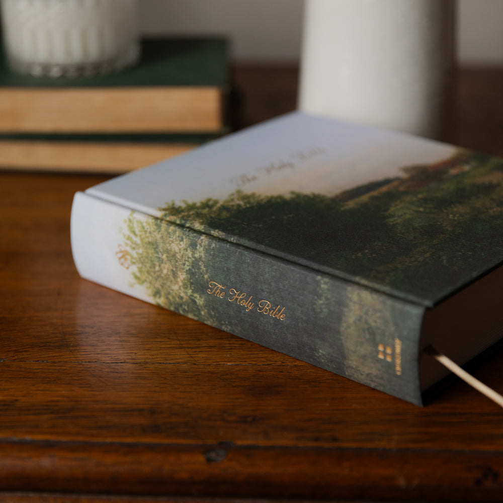 A Bible on a wooden surface with blurred background