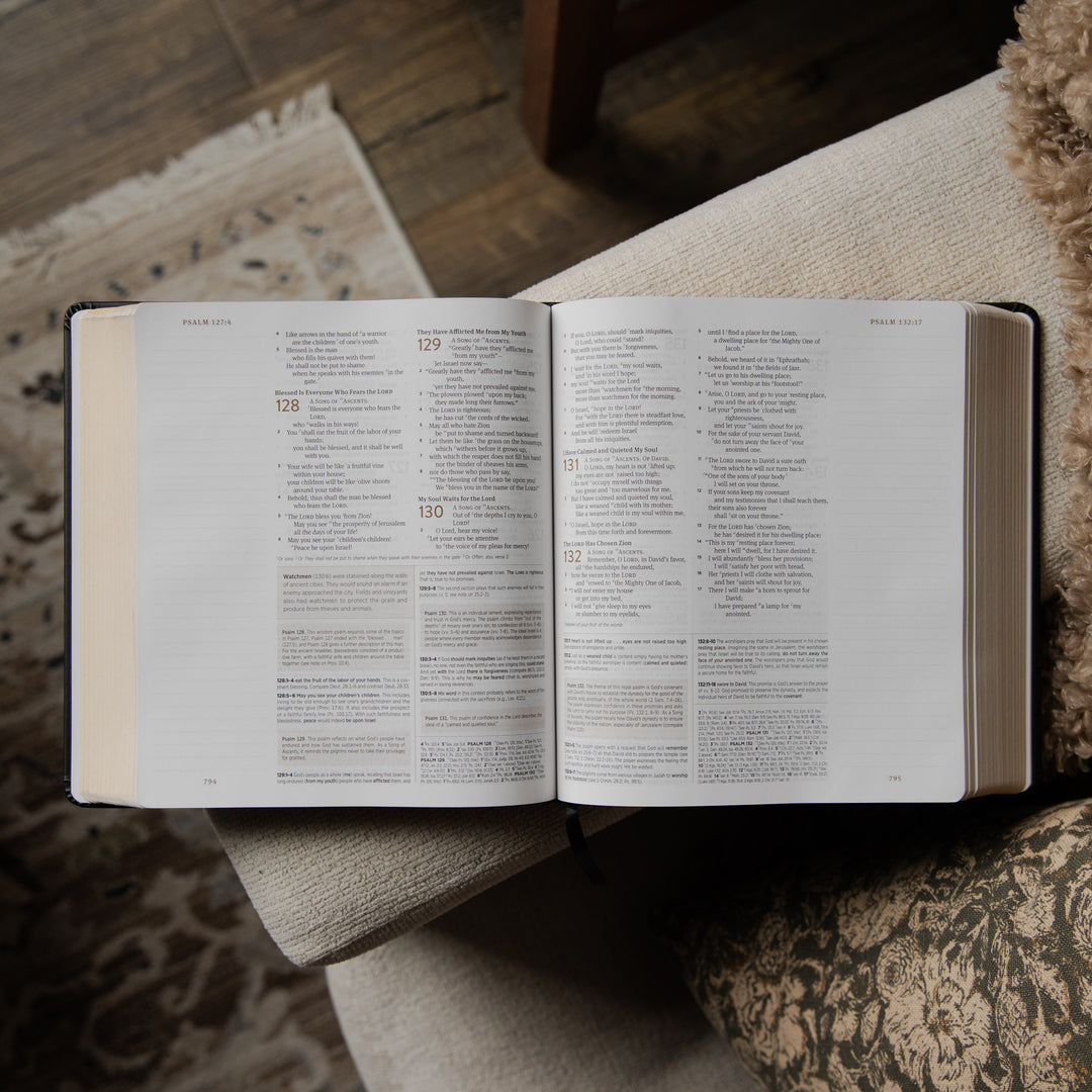 Open bible on a textured surface with a blurred background