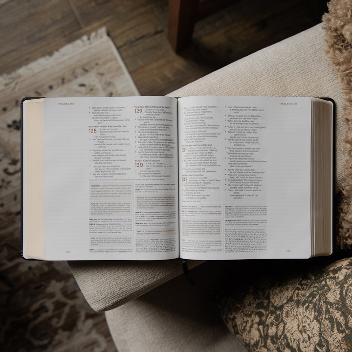 Open bible on a textured surface with a blurred background
