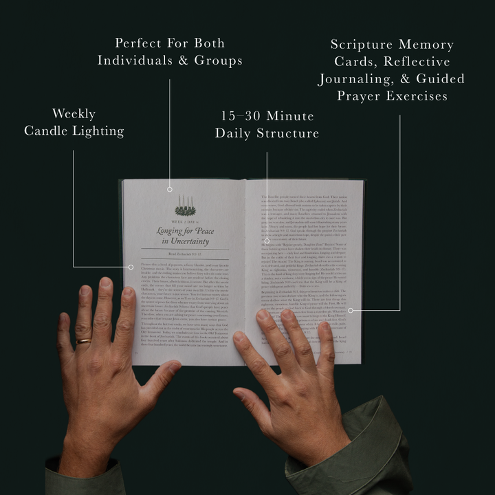 An open book with printed pages shown against a dark background, with callout lines and text describing features such as weekly candle lighting, 15-30 minute daily structure, scripture memory cards, reflective journaling, and guided prayer exercises. Two hands are visible holding the book.