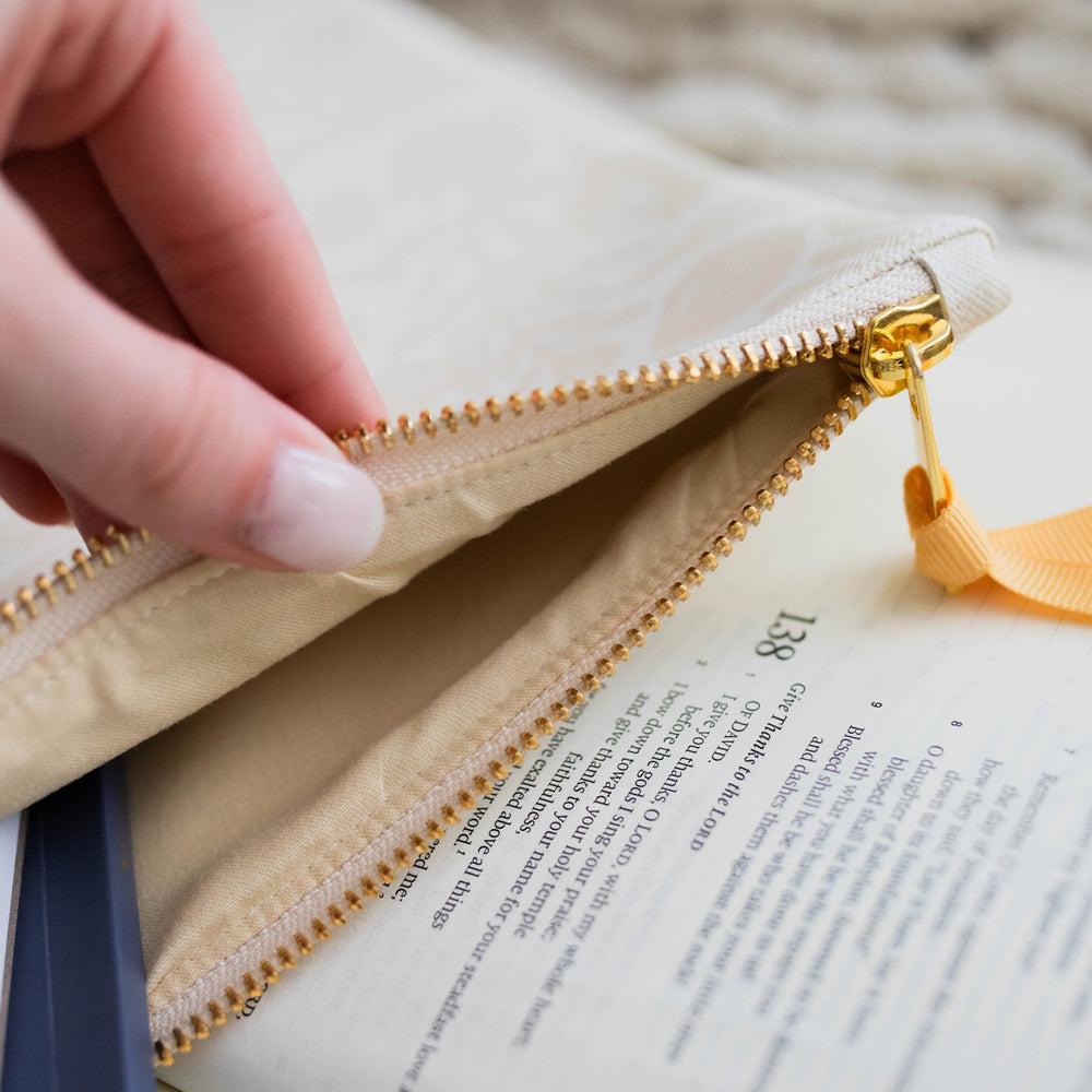 Hand showing the inside of the Laurel Carry All Pouch - Natural.