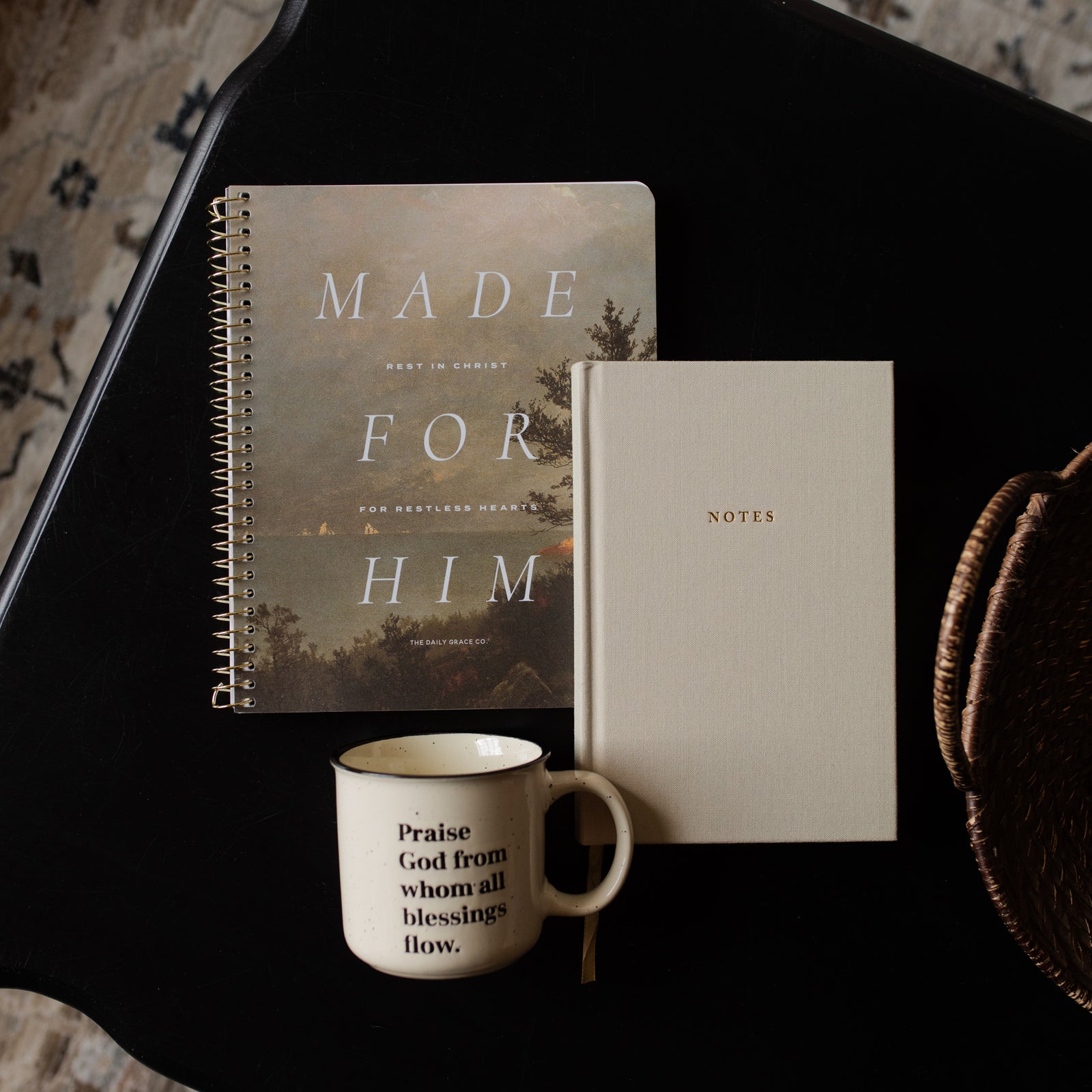 Notebook titled 'Made for Him' and a smaller notebook titled 'Notes' on a dark surface with a mug.