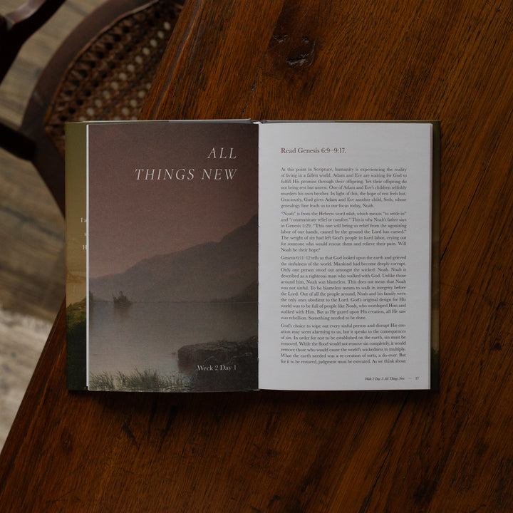 Made for Him book opened to the Genesis reading page on a wooden table near a chair