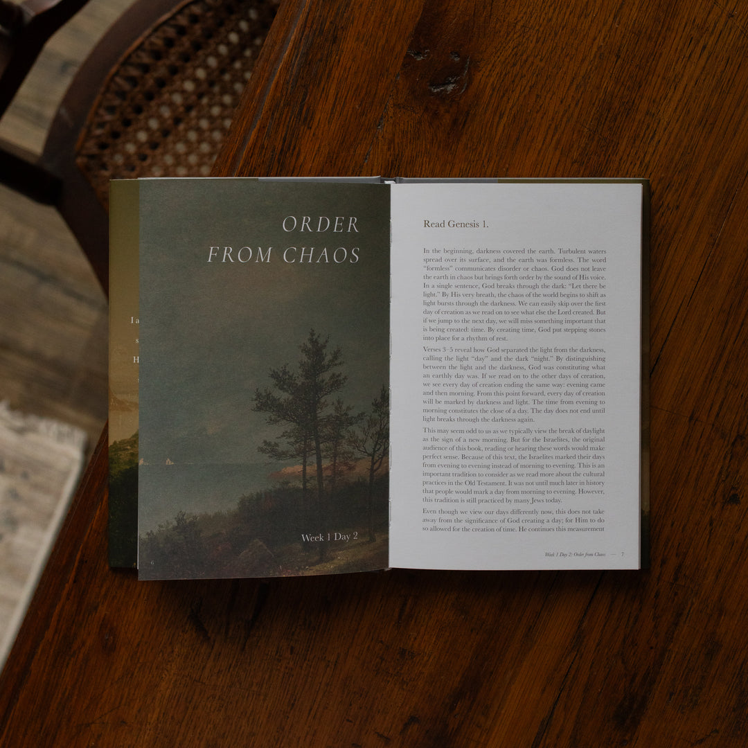 Made for Him book opened to Week 1 Day 2 page on a wooden table near a chair