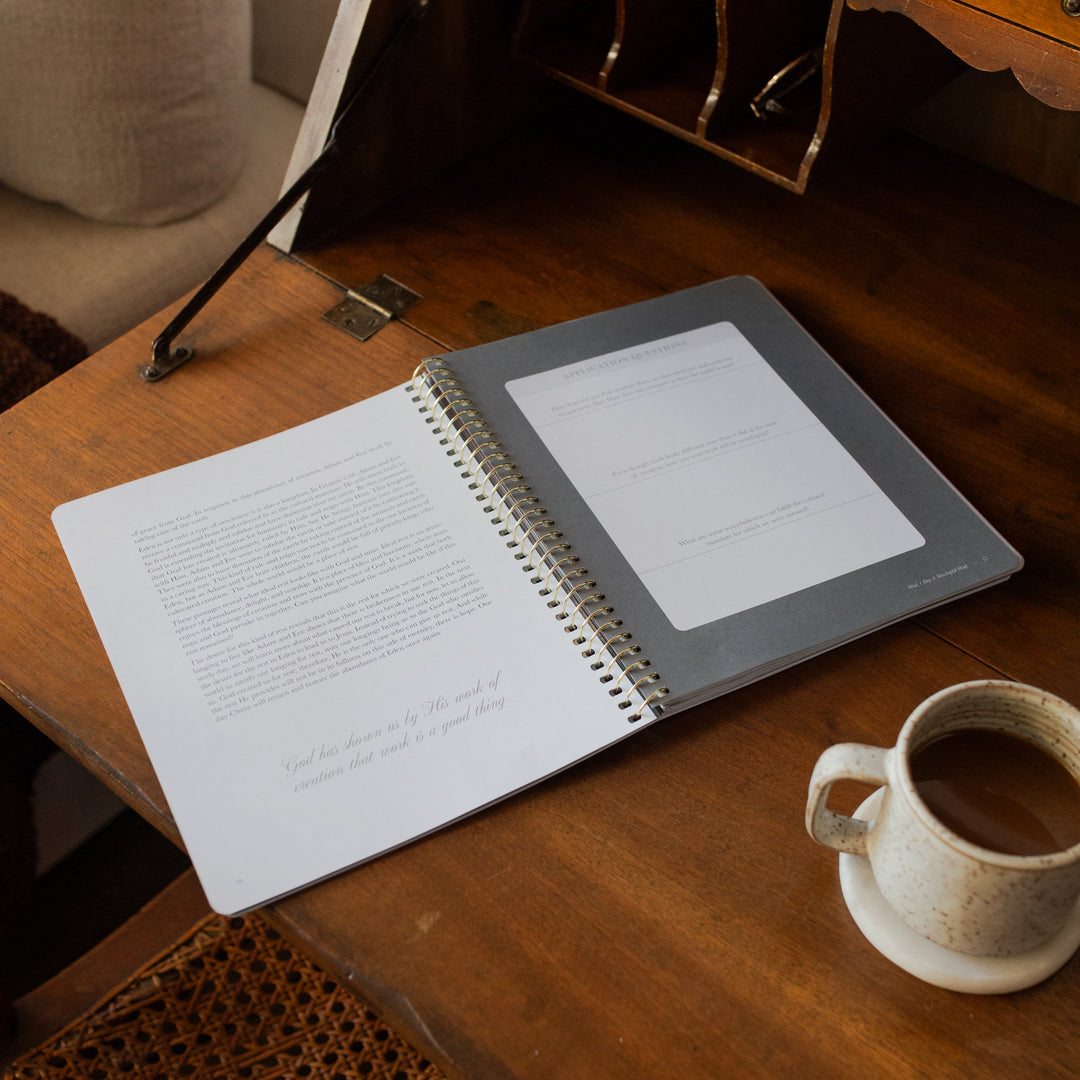 Made for Him Spiral study opened to the applications and questions page on a wooden table near a coffee cup
