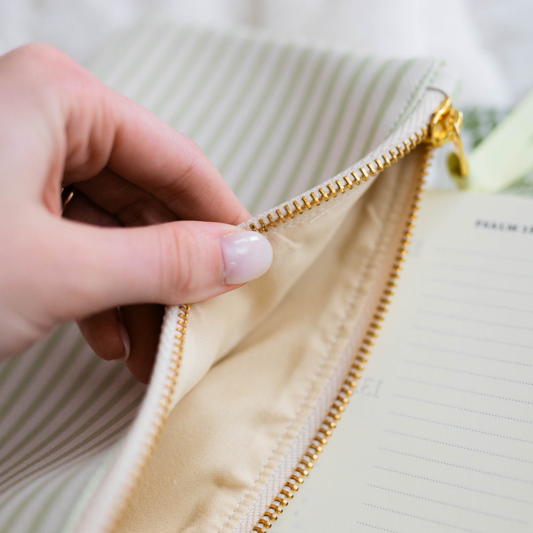 Hand opening Made New Pencil Pouch showing the inside material 