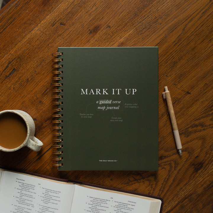 Mark It Up Journal cover next to a pen and a coffee cup