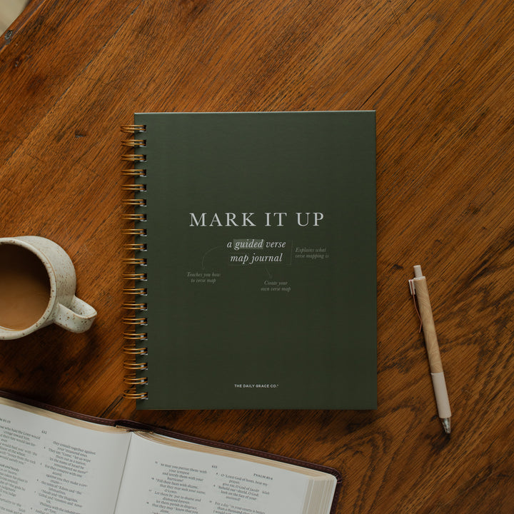 Mark It Up Journal cover next to a pen and a coffee cup