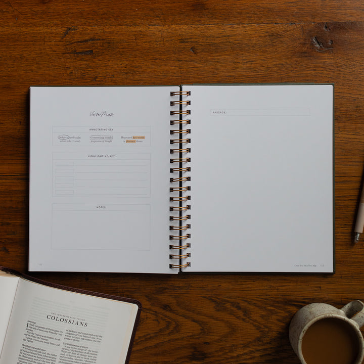 Mark It Up Journal opened to a blank verse map page next to a pen